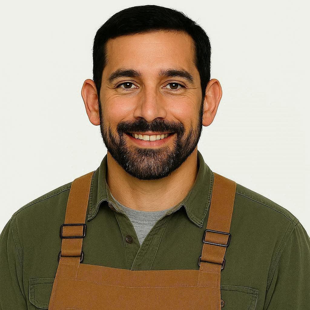 Portrait of a rugged man with silver hair and a work-worn cap, friendly expression